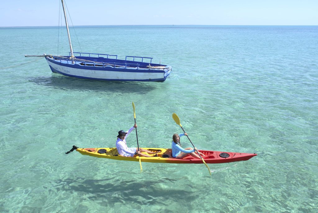 AZURA RETREATS Azura Benguerra kayaking past a dhow - Ganders Travel